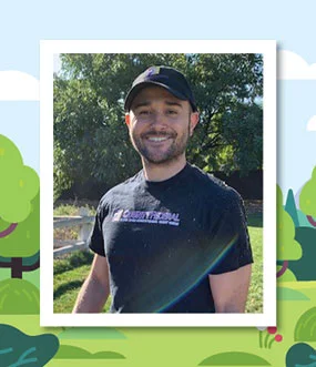 Man wearing a black shirt and hat smiling