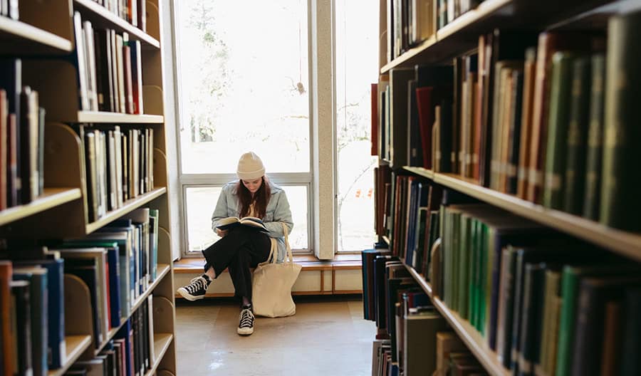 Woman reading in library