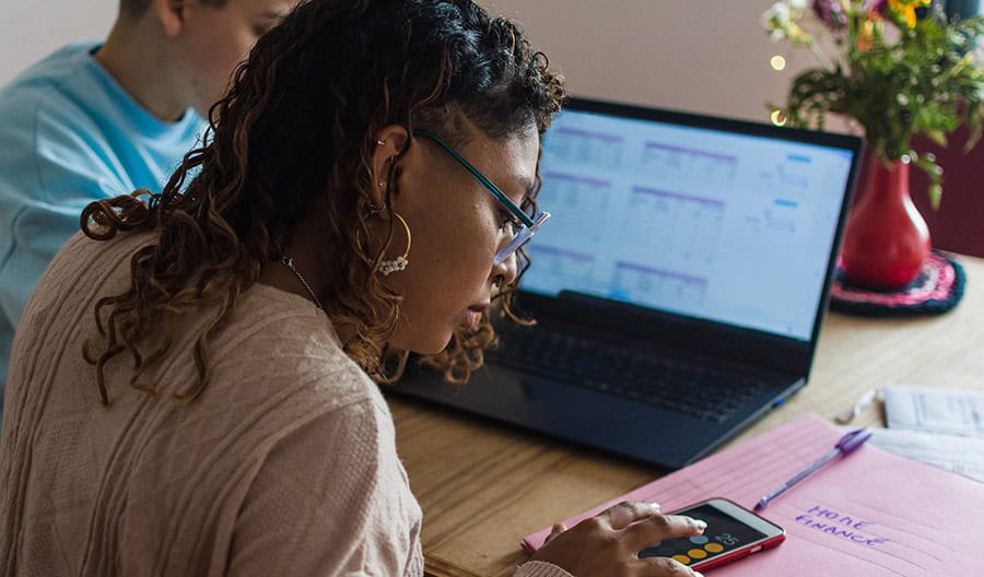 Woman using calculator