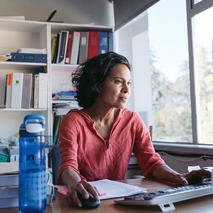 Woman-Wearing-Red-Using-Computer
